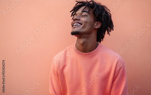 man smiling with sweatshirt in color background