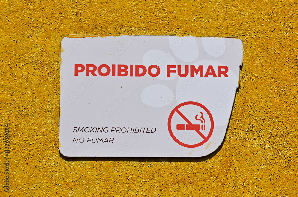 Yellow wall with sign reading: no smoking
