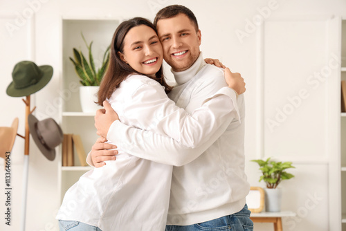Happy young couple hugging ...
