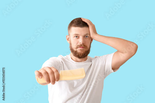 Worried young man with hair...
