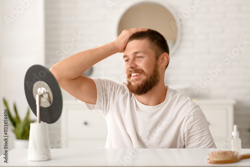 Happy young man with hair l...