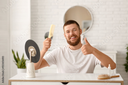 Happy young man with hair l...