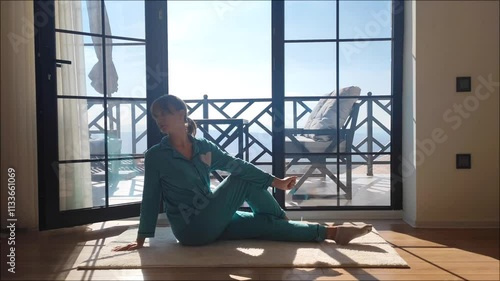 Wallpaper Mural woman makes morning exercise at home on the floor. High quality FullHD footage Torontodigital.ca