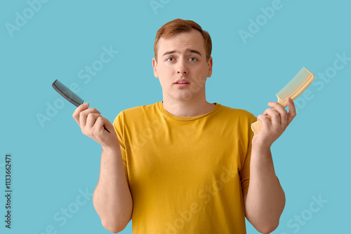 Worried young redhead man w...