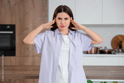 Young woman feeling pain in...