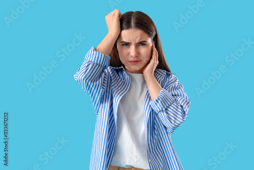 Young woman feeling pain in...