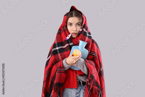 Ill young woman with thermo...