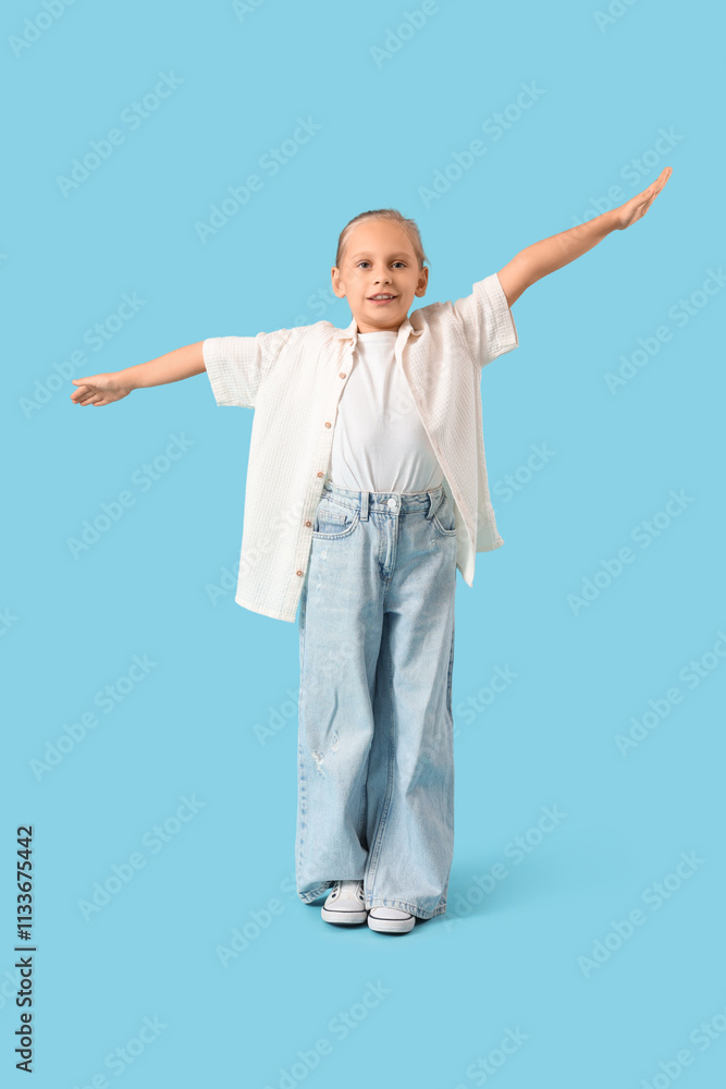Carefree little girl on blue background Carefree little girl on blue background