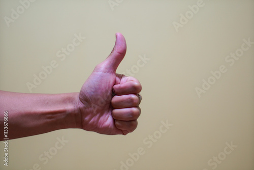 Human hand / Human hand show thumb up on white background.
 photo