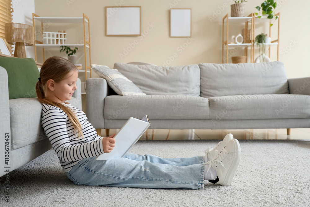 Funny little girl reading book at home Funny little girl reading book at home