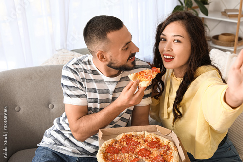 Young couple with pepperoni...