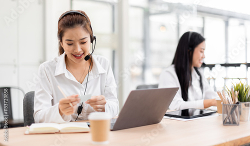 Asian call center team, customer service, telesales wearing headset or headphone talking with customer in the office. Customer Service Representative, Service, Call Center, 