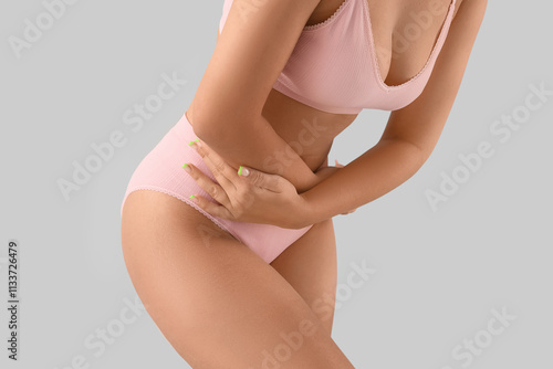 Young woman in underwear su...