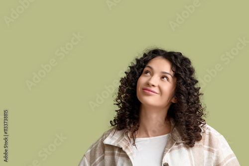 Young woman looking upwards...