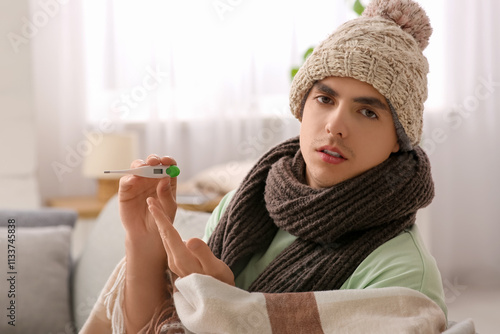 Sick young man in a knitted...