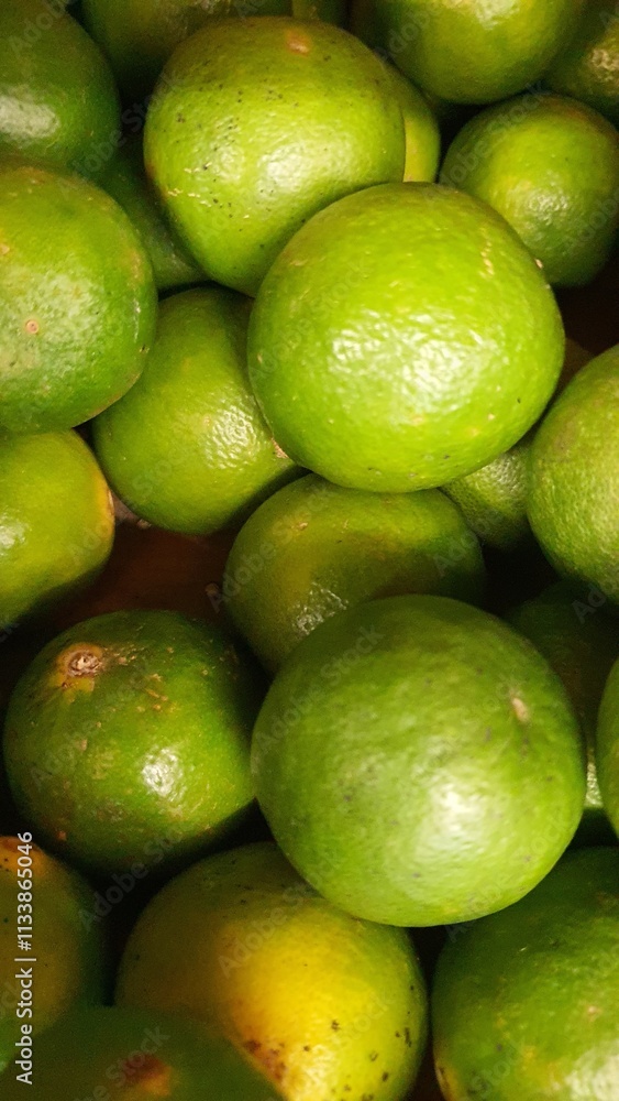 Close up pile of tasty fresh limes sold at the market as a background. Close up pile of tasty fresh limes sold at the market as a background.