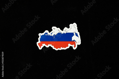 Map of Russia in Russian flag colors on black background photo