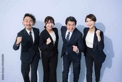 Image of goals, future, running, starting, multiple camera-ready businessmen posing with guts, light blue background