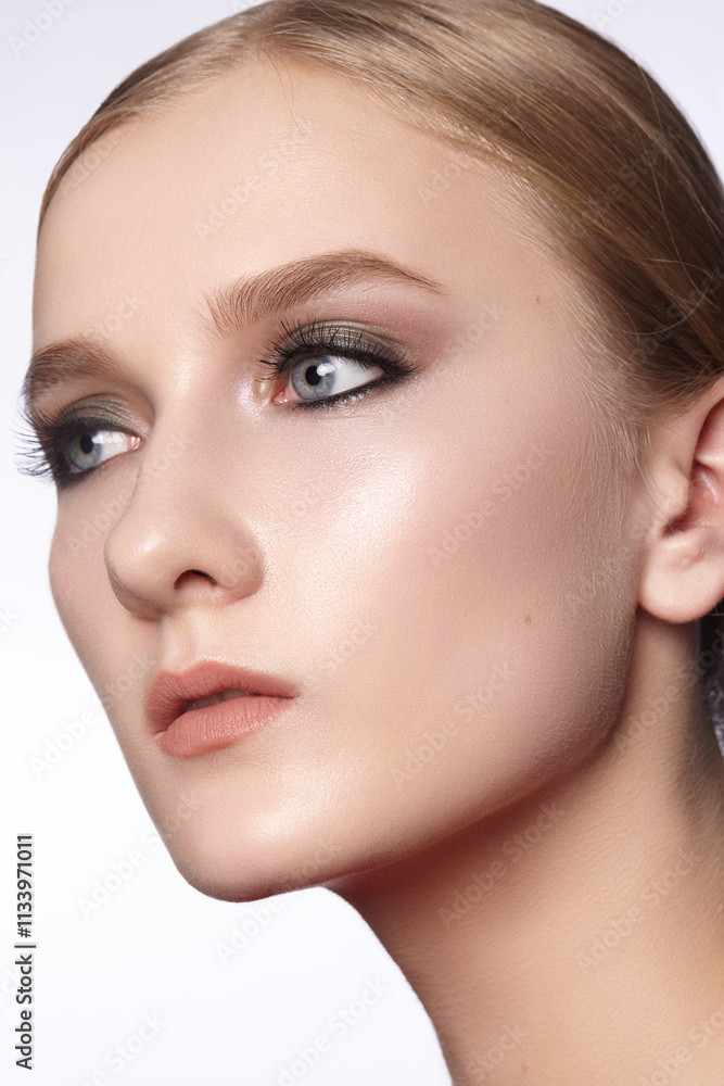 Fototapeta premium Beautiful Woman with an Fashion Hairstyle and Creative Makeup. Beauty face with trendy Make-up