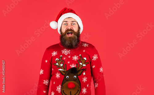 man in santa hat await christmas present. the morning before Xmas. hipster enjoy the holiday. new year shopping idea concept. ready for party celebration. bearded man in sweater photo