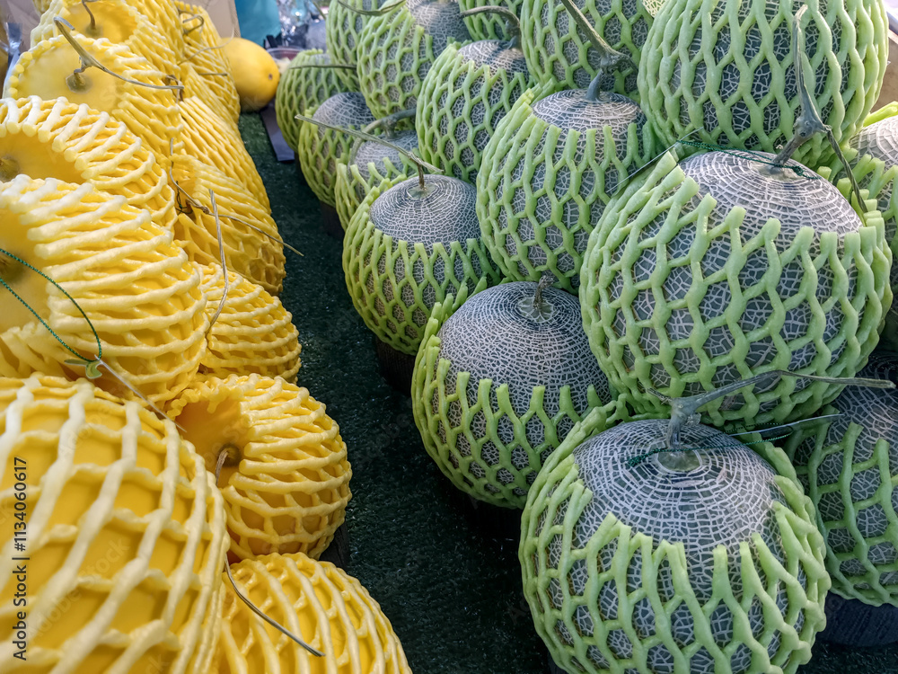 nice stack of green melon and yellow watermalon nice stack of green melon and yellow watermalon