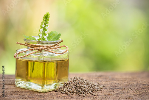 Perilla flowers ,oil and seeds on natural background. photo