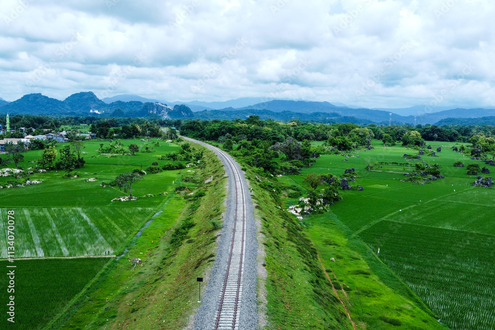 View of railway tracks in rural Indonesia in the afternoon View of railway tracks in rural Indonesia in the afternoon