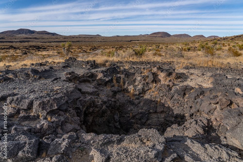 Lava Tube, Cinder Cone / Scoria Cone with Lava Flow. Cima volcanic field. Kelbaker Road, Mojave National Preserve. San Bernardino County, California. Mojave Desert / Basin and Range Province. Lava Tube, Cinder Cone / Scoria Cone with Lava Flow. Cima volcanic field. Kelbaker Road, Mojave National Preserve. San Bernardino County, California. Mojave Desert / Basin and Range Province.