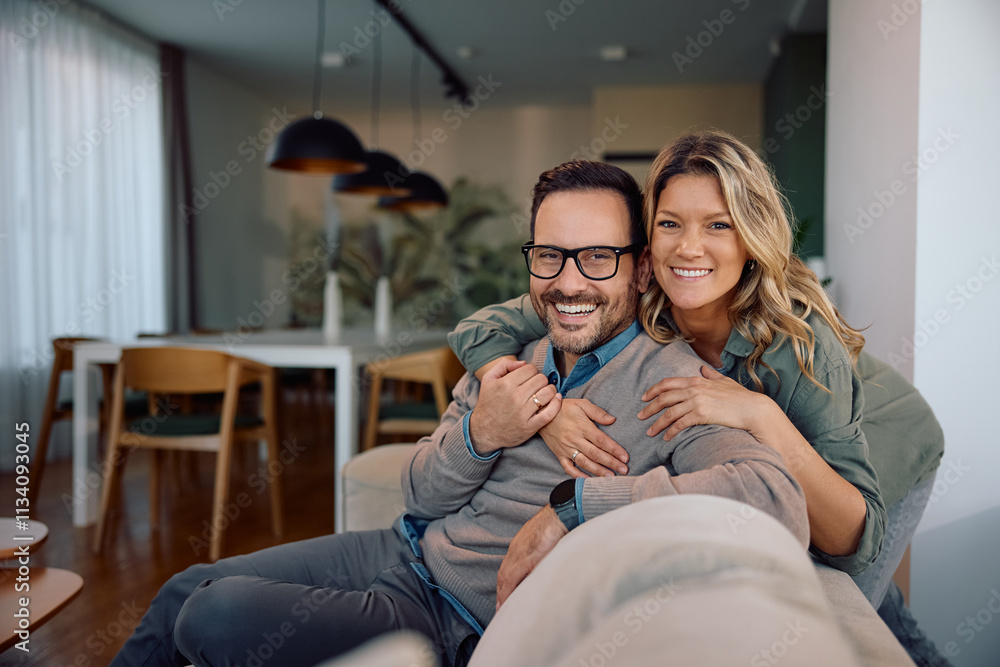 Portrait of happy couple at home looking at camera. Portrait of happy couple at home looking at camera.