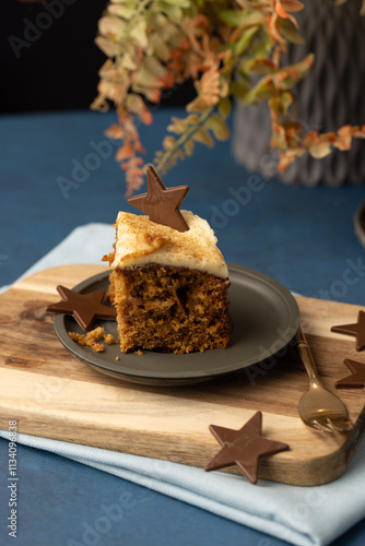 Crumbly rich carrot cake slice on table 