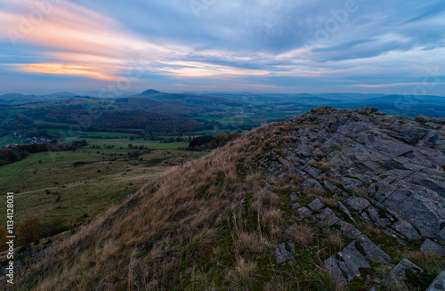 Sonnenuntergang über der Abtsrodaer Kuppe im Herbst, ein Nebengipfel der Wasserkuppe, Biosphärenreservat Rhön, Hessen, Deutschland photo