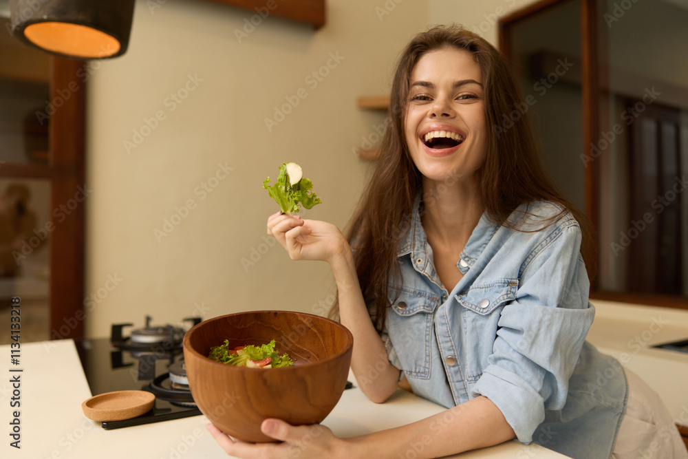 Young woman enjoying healthy eating while preparing a fresh salad in a modern kitchen, showcasing a joyful expression and vibrant colors Young woman enjoying healthy eating while preparing a fresh salad in a modern kitchen, showcasing a joyful expression and vibrant colors