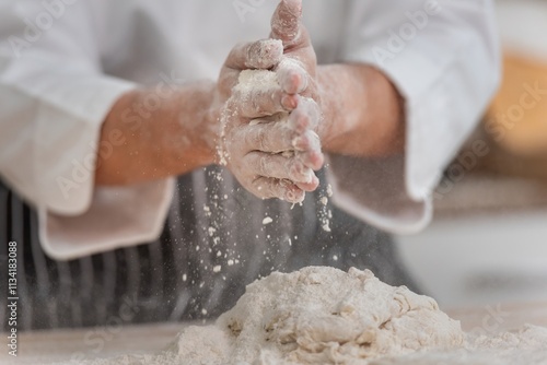 Photography professional Chef sifting flour powder and sprinkling ingredients on massaging dough for bakery cooking