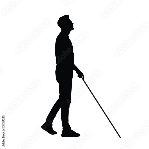 Silhouette of a blind man walking with a cane