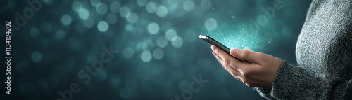 Close-up of person hand holding smartphone with glowing effects on dark background. photo