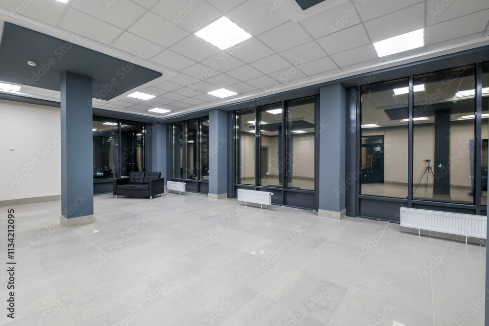panorama view in empty modern hall with columns, doors and panoramic windows at night panorama view in empty modern hall with columns, doors and panoramic windows at night