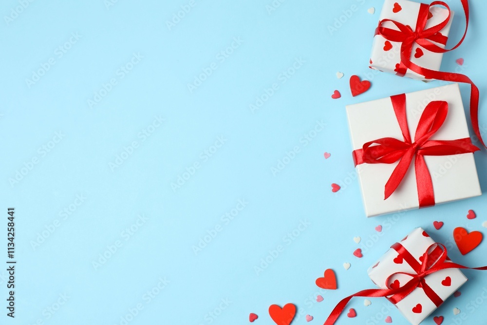 Gift boxes with red hearts on color background Gift boxes with red hearts on color background