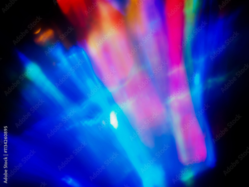 A colorful, blurry background with a rainbow of colors. The colors are bright and vibrant, creating a sense of energy and excitement. Abstract design wall paper. Cinematic light effect. A colorful, blurry background with a rainbow of colors. The colors are bright and vibrant, creating a sense of energy and excitement. Abstract design wall paper. Cinematic light effect.