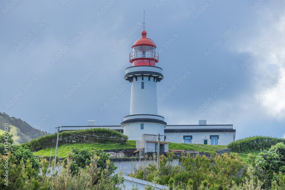 Farol Da Ponta Do Topo Lighthouse distant view in Sao Jorge Azores Portugal Farol Da Ponta Do Topo Lighthouse distant view in Sao Jorge Azores Portugal