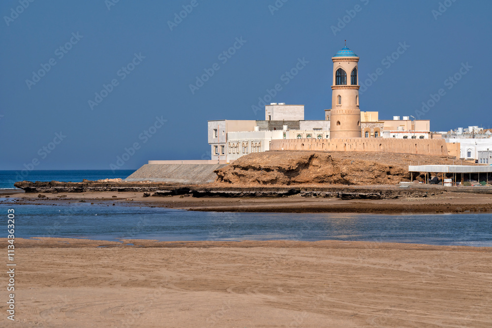 Sur (Ṣūr,Sour) Ash Sharqiyah Oman Sultanat Moyen Orient. Lighthouse and Traditional wooden dhow boats in Sur, Oman Sur (Ṣūr,Sour) Ash Sharqiyah Oman Sultanat Moyen Orient. Lighthouse and Traditional wooden dhow boats in Sur, Oman