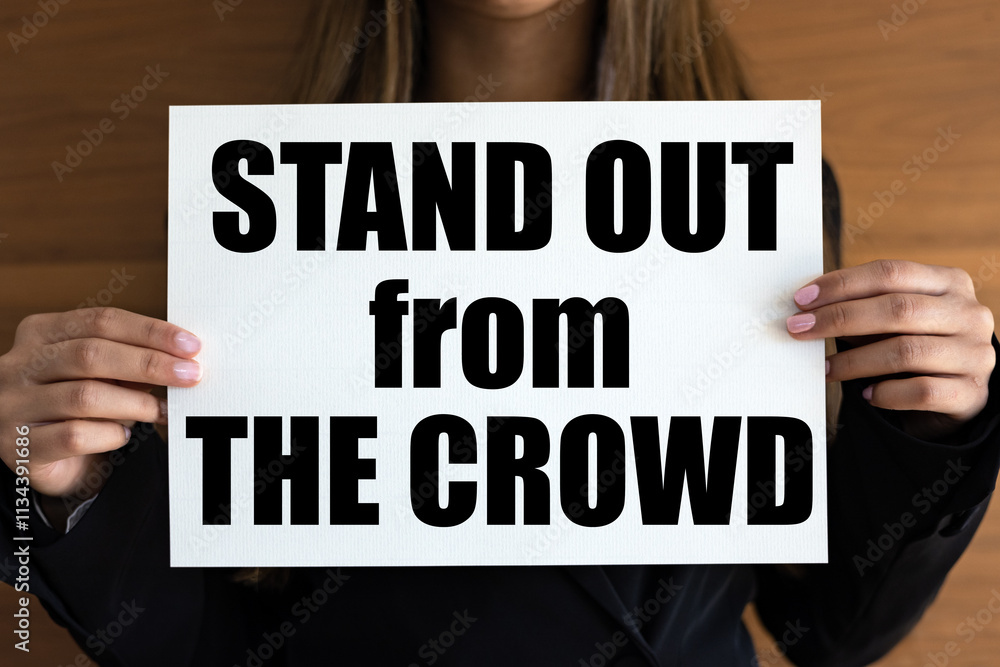 © Westlight - Stand out from the crowd. Woman with white page, black letters. Various, different, individual, unique. © Westlight - Stand out from the crowd. Woman with white page, black letters. Various, different, individual, unique.