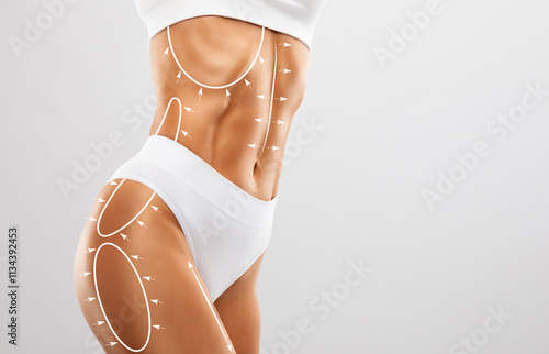 A slender swarthy woman in beige underwear on a white background. Healthy lifestyle, sport and diet. photo