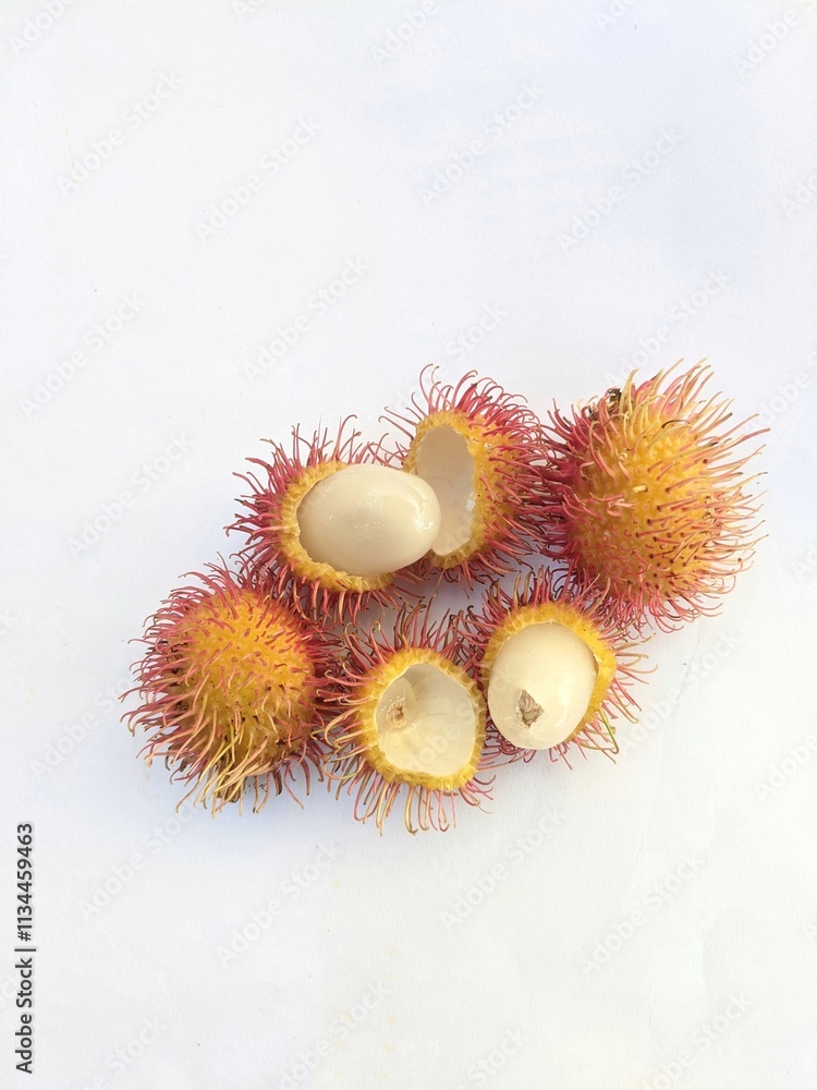 Ripe rambutan fruit on a white background Ripe rambutan fruit on a white background