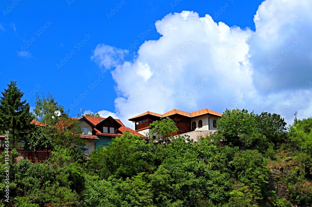 Residential buildings on the edge of a rocky mountainside in Sarajevo
Residential buildings on the edge of a rocky mountainside in Sarajevo