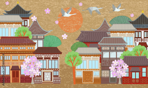 vintage asian cityscape with buildings of traditional decorative walls, doors, roofs. sunny east town with blooming trees against grunge brown background. flying crane birds in the sky