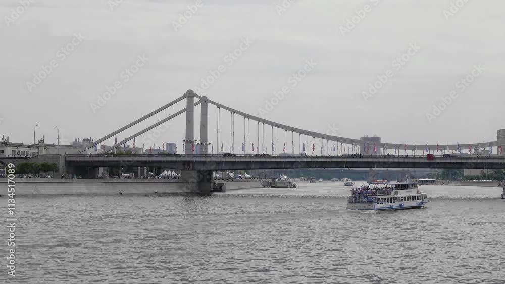 View of the Crimean Krymsky bridge in Moscow from the Gorky park, a popular touristic landmark and place for walking in Moscow. View of the Crimean Krymsky bridge in Moscow from the Gorky park, a popular touristic landmark and place for walking in Moscow.