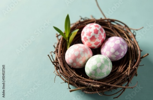 Nest of twigs with Easter eggs in pastel colors on a light background, space for advertising, text, words photo