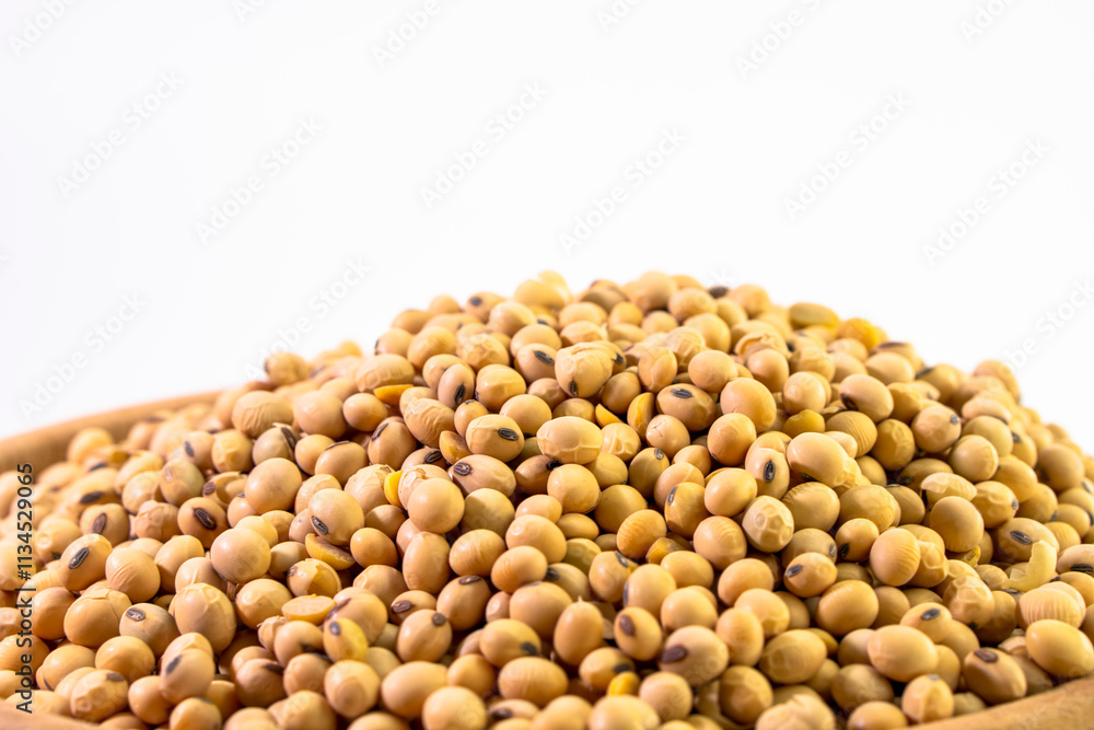 Organic soy beans falling into a rustic wicker bowl. Raw dried soya grains. Healthy legume ingredient. Rotation. Food Organic soy beans falling into a rustic wicker bowl. Raw dried soya grains. Healthy legume ingredient. Rotation. Food