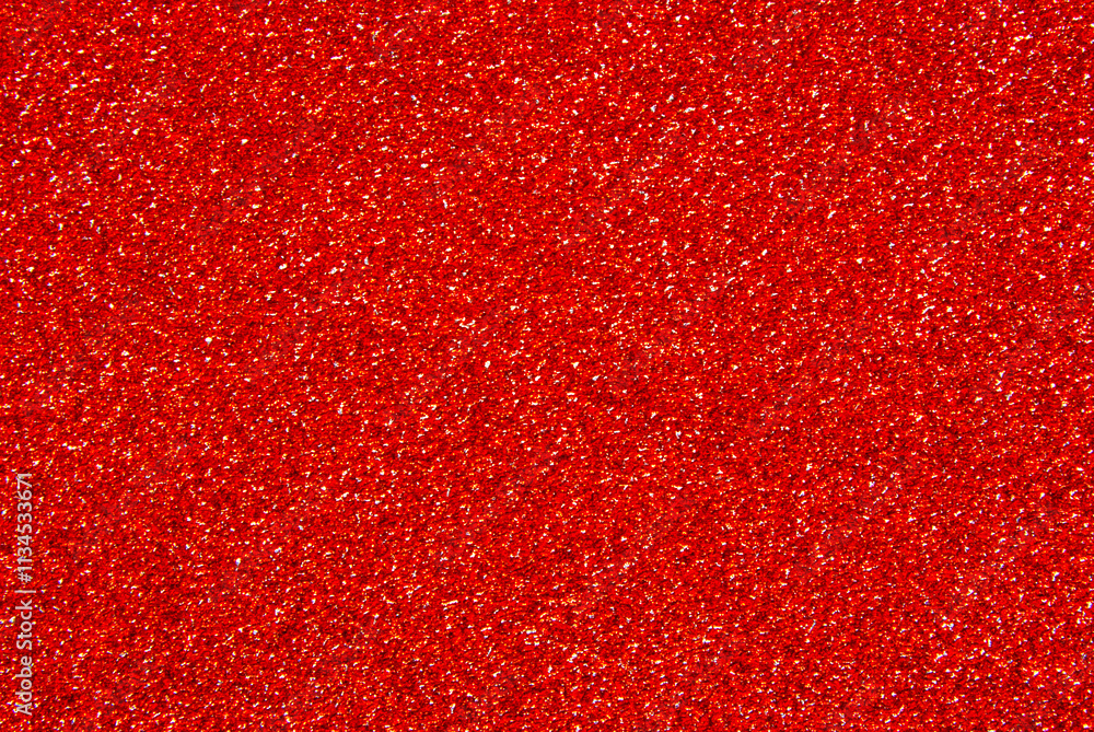 Red color glitter paper texture close up as background Red color glitter paper texture close up as background