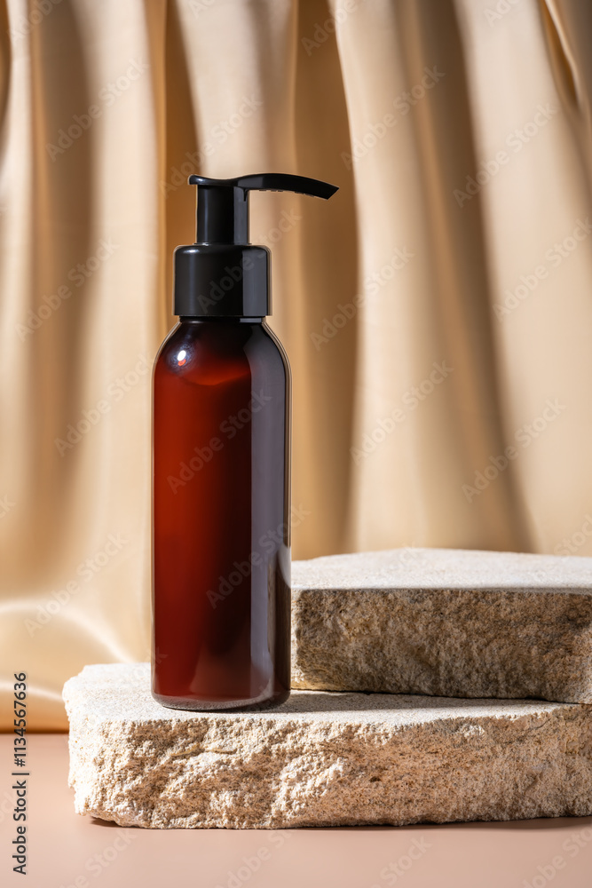 Pomp dispenser bottle with hand or body lotion stands on natural stone podiums against beige textile drapery. Skin care cosmetics presentation. Pomp dispenser bottle with hand or body lotion stands on natural stone podiums against beige textile drapery. Skin care cosmetics presentation.